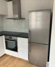 Sanierung einer 2-Zimmer Wohnung in Stuttgart mit Blick auf einen Teil der eingebauten Küchenzeile