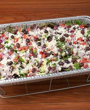 Mediterranean Greek Salad Catering Tray: mixed greens, feta cheese, diced tomatoes and cucumbers, and homemade balsamic dressing