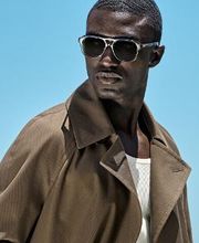 This mid green trench coat features a knee-length cut and a classic 6-on-2 double-breasted closure. Raglan shoulders, notched lapels, and a detachable belt add structure and style. Lined with sleeve straps.