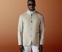 This light brown shirt-jacket is cut to a relaxed fit — easy through the chest and shoulders with a clean, unstructured silhouette — and features a stand collar, patch pockets, and a four-button fastening.