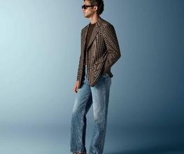 This mid brown checked blazer is cut to a relaxed fit — roomy through the chest and waist with a soft, natural shoulder — and features a notch lapel, patch pockets, and half-canvas construction.