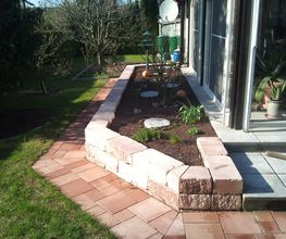 Gartengestaltung mit Trockenmauer,Pflasterarbeiten und Bepflanzung