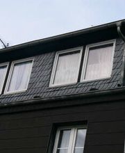 Dachgauben mit Schiefer