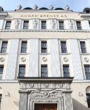 Front of the historic Knorr-Bremse Group building at the company's headquarters in Munich, with the words Knorr-Bremse AG in gold letters at the top.