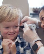 Jennifer Dang, MD, with a pediatric patient