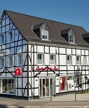 Aussenansicht der Apotheke in der Aue