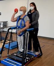 Physical therapist with a patient at FYZICAL Therapy & Balance Centers in Lutherville, MD