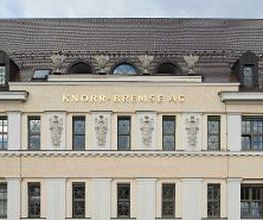 Front of the historic Knorr-Bremse Group building at the company's headquarters in Munich, with the words Knorr-Bremse AG in gold letters at the top.