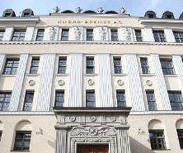 Front of the historic Knorr-Bremse Group building at the company's headquarters in Munich, with the words Knorr-Bremse AG in gold letters at the top.