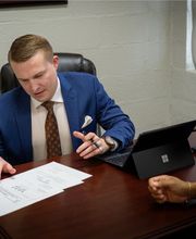 Nick Wright Defense Lawyer at Work on a defense case in Norfolk Office