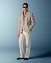 This sand blazer is cut to a relaxed fit for a comfortable, slightly looser silhouette with natural shoulders. It features wide notch lapels, patch pockets, and a single-breasted closure.