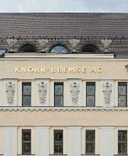 Front of the historic Knorr-Bremse Group building at the company's headquarters in Munich, with the words Knorr-Bremse AG in gold letters at the top.