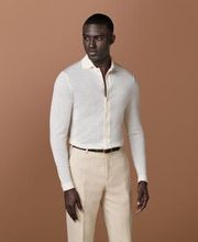 The warmth and comfort of a cardigan meets the relaxed versatility of a polo in this dynamic off-white knit—pair it with a blazer or wear it untucked on its own, it's perfect for any elevated casual occasion.