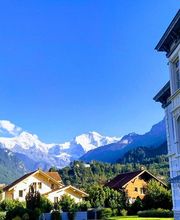 Direct views of the snowcapped Eiger, Mönch & Jungfrau mountains are included at the Adventure Hostel Interlaken