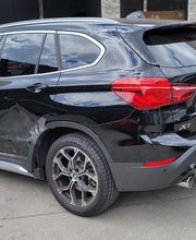 Victor inspecting vehicle prior to repairs