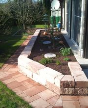 Gartengestaltung mit Trockenmauer,Pflasterarbeiten und Bepflanzung