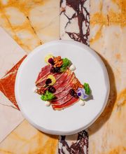Chef’s Signature: Duck ham with smoked walnuts, sweet and sour blueberries and crème fraîche