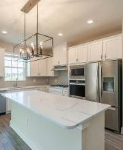 Upgraded light fixtures, wood style flooring and more are included