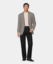This checked black blazer is cut to a relaxed fit, providing a roomier feel through the chest and shoulder with natural shoulders. It features a single-breasted closure, wide notch lapels, and jetted pockets.
