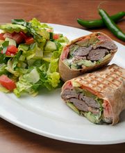 Koobideh Wrap: Ground All Natural ABF Beef Kabob, Tzatziki, Romaine Lettuce, Tomato, Cucumber, Pickle, Mint, Basil in a Tortilla