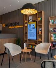 Neuroth Hörcenter AG - Hörgeräte und Gehörschutz Bild 3