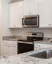 Granite countertops and stainless steel appliances are included in every home.