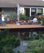 Gartengestaltung mit Terrasse und Teichbau