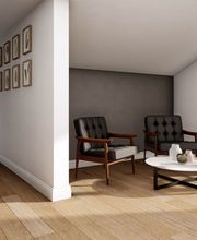 Eines unserer hellen Schlafzimmer mit gemütlichen Sitzbereich direkt am Balkon