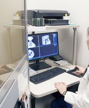 Jennifer Dang, MD, reviewing a patient's imaging