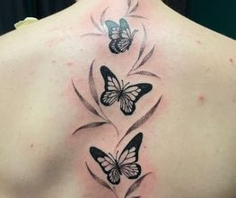 Raketenwacholder Tattoo und Piercing Bild 2