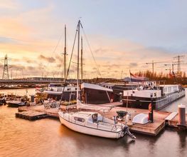 modern-vessels-near-quay-at-sunset-2022-01-28-06-56-43-utc.jpg