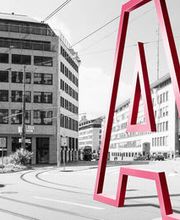 Adimmo Logo vor Gebäude von hinten