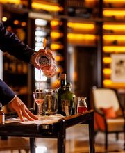 Our tempting drinks trolley welcomes you with a fine selection of wines, cocktails and spirits rigth at your armchair.