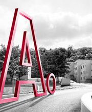 Adimmo Logo vor Gebäude von vorne