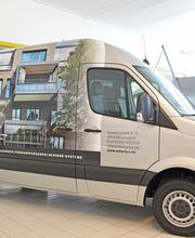 Fahrzeugbeschriftung - Vollfolierung eines Transporters. Produziert von Schrader-Kamin Werbetechnik aus Vlotho.