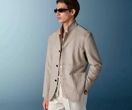 This sand blazer is cut to a relaxed fit for a comfortable, slightly looser silhouette with natural shoulders. It features wide notch lapels, patch pockets, and a single-breasted closure.