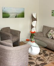 Wohnzimmer der Pastor's Stuv mit Kaminofen