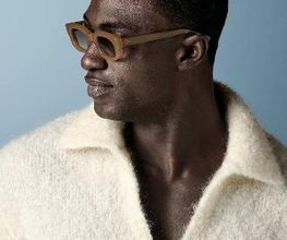 This off-white polo sweater features an open V-neck with a spread collar and no button placket, knitted in a soft, fluffy bouclé texture with long sleeves and a relaxed silhouette.