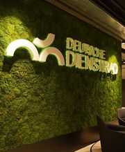 DD Deutsche Dienstrad GmbH: Innenansicht mit grüner Logo-Wand