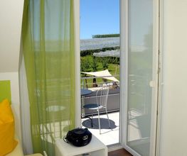5-Sterne-Ferienwohnung "Elstar" - Wohnbereich mit Terrassenblick