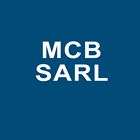 M C B
