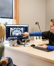 Dr. Holmes educating his patient