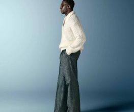 This off-white polo sweater features an open V-neck with a spread collar and no button placket, knitted in a soft, fluffy bouclé texture with long sleeves and a relaxed silhouette.
