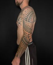 Raketenwacholder Tattoo und Piercing Bild 3