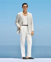 This sand blazer is cut to a tailored fit, providing a sharp silhouette with natural shoulders. It features a notch lapel and flap pockets for a refined, versatile look.