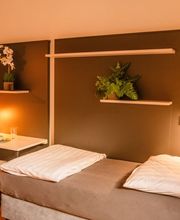 Workspace und Bett des Businessapartments Urban Smart