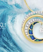 Na Hoku - Hawaii's Finest Jewelers Since 1924 logo, Opal and Diamond Ultimate Wave pendant, crashing ocean wave in background.