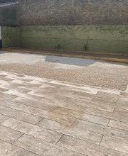 Terrasse en dallage imitation bois, terrain de pétanque et cour en ALVEOSTAR Beige sur la commune D'ANNAY SOUS LENS