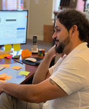 cesar behind desk working