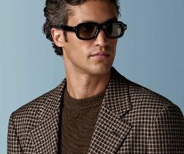 This mid brown checked blazer is cut to a relaxed fit — roomy through the chest and waist with a soft, natural shoulder — and features a notch lapel, patch pockets, and half-canvas construction.